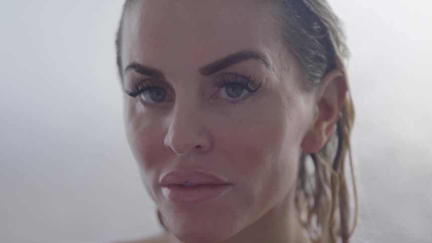 A woman turns her head to look forward