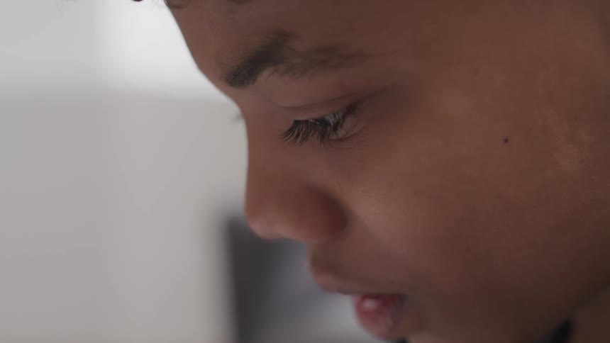 Close up of the profile of a young boy face