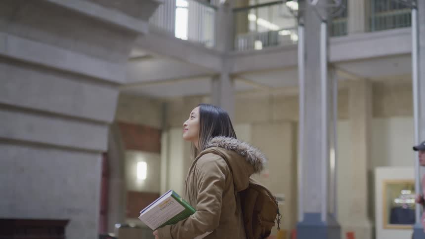 A woman is looking around in the school