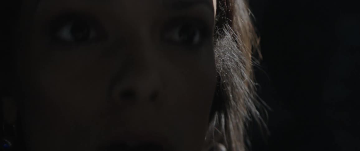 Close up of woman's face looking scared