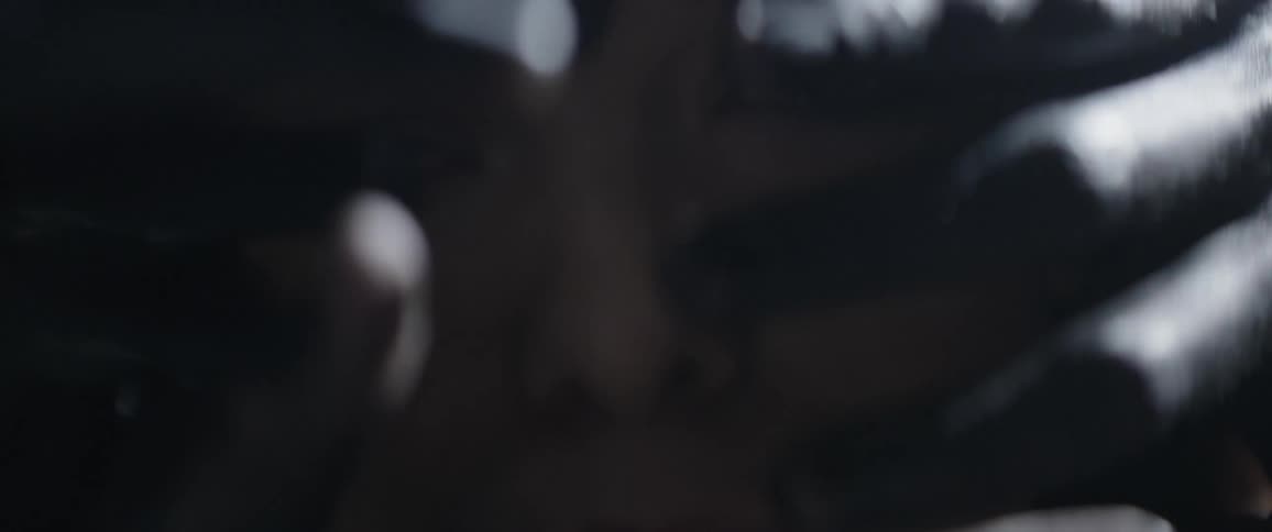 Hands reach around and cover a woman's face
