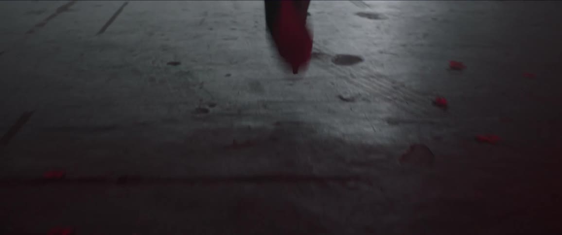 Person running on pavement on a sunny day