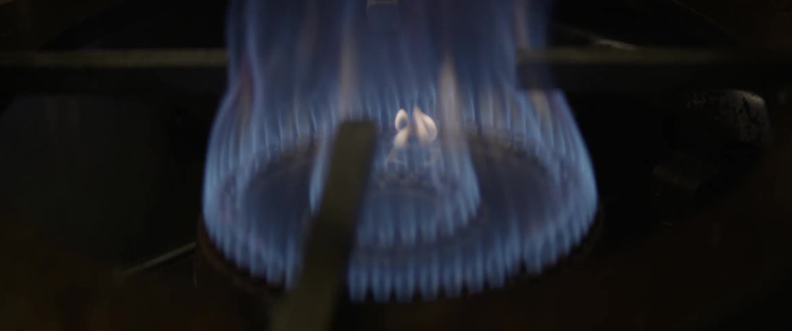A stove top burner is turned on