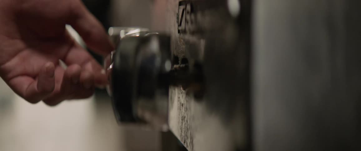 A stove top burner knob is turned on