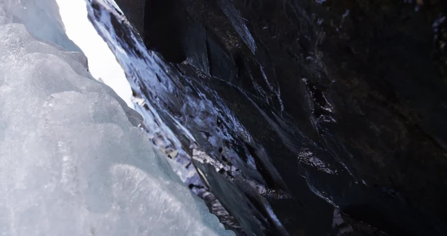 Water drips from ice and rock in springtime