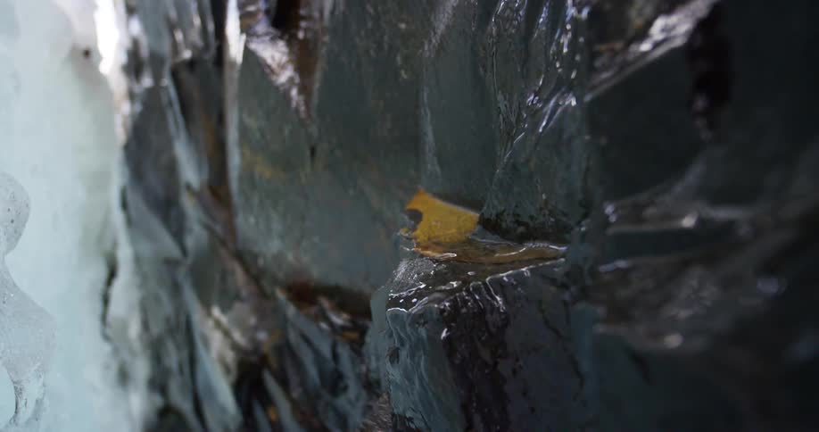 Ice melting onto rocks
