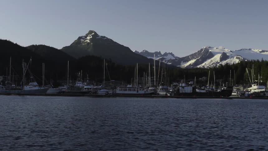 Many boats float on a mountain lake