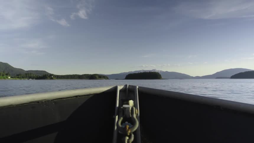 A boat floats on a mountain lake