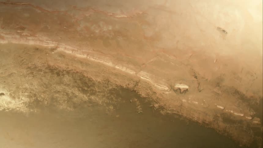 A planet with lines and craters