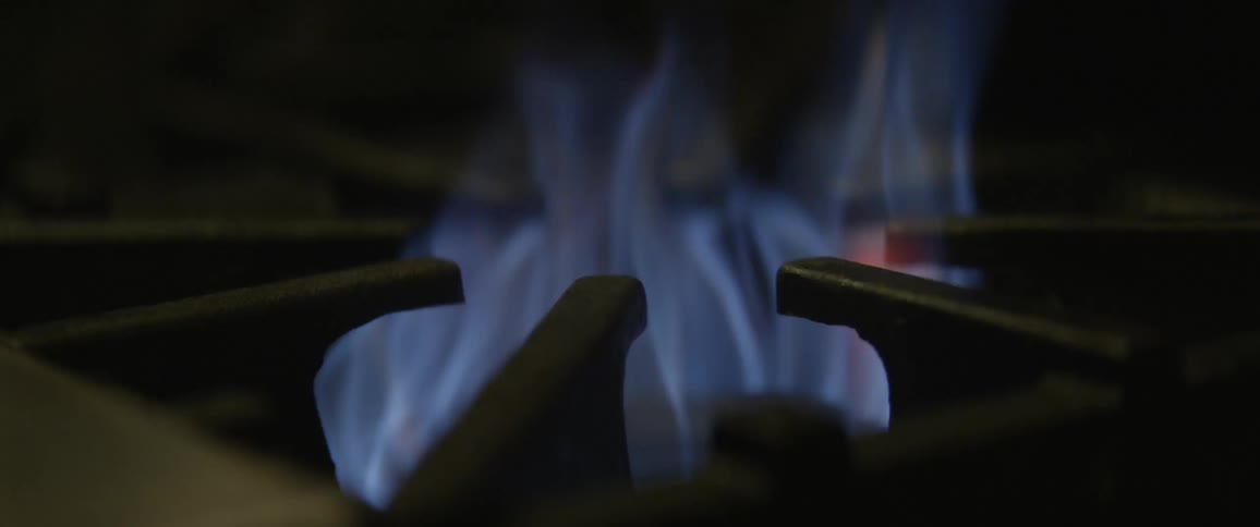 Flame ignites on burner stove top