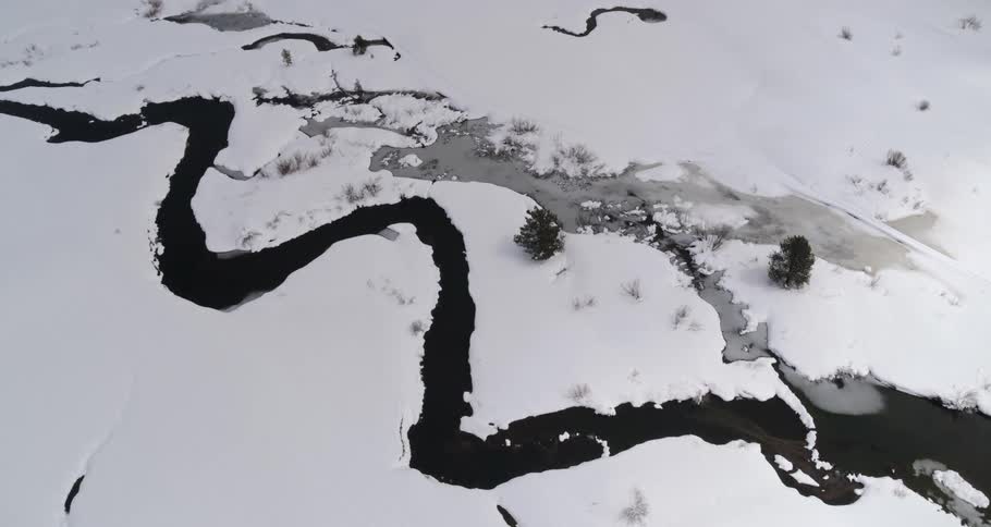 An aerial view of an arctic area is displayed