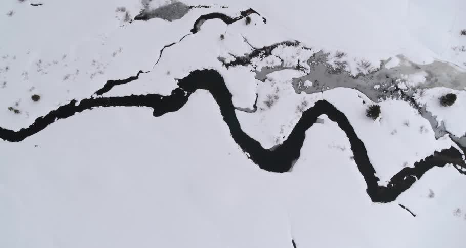 An aerial view of an arctic area is displayed