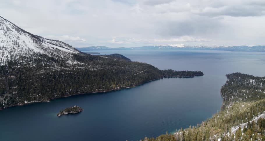 The mountains line the sides of the large lake