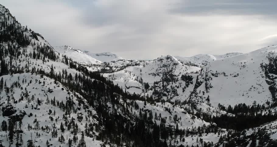 Snow completely covers the a range of mountains in the heart of winter