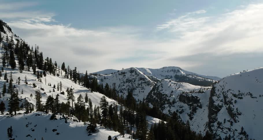 A snow covered mountain ridge on a sunny day