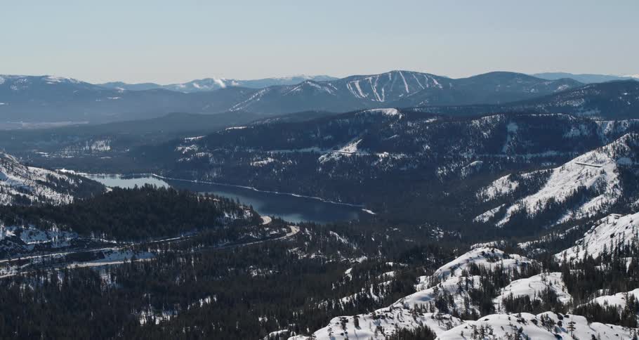 An aerial view of a mountain is displayed