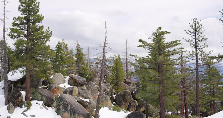 Large rocks and snow are on the mountain top
