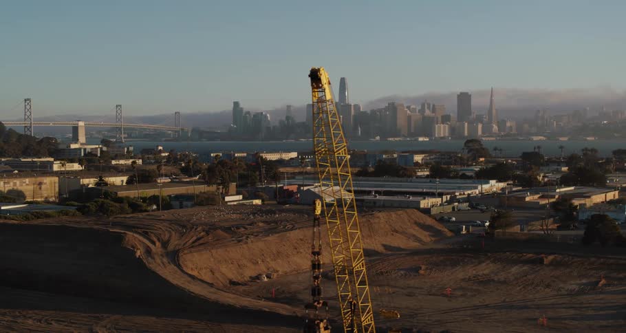 A construction site with a skyline in the distance