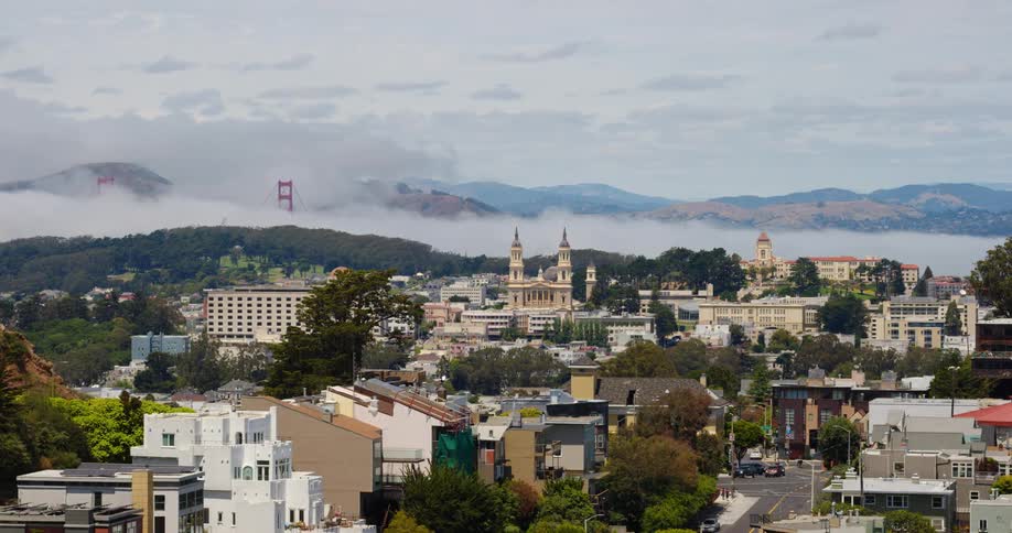 An aerial view of a downtown city is displayed during midday