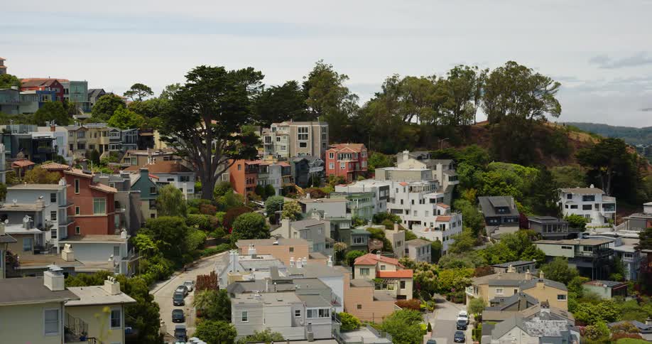 A small town on a hillside on a sunny day