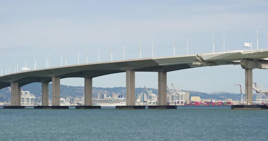 A large bridge over a bay on the coast of city on a sunny day