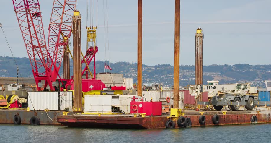 The freight ship is docked at the port