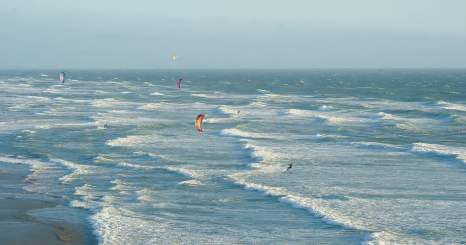 People windsurfing in the water