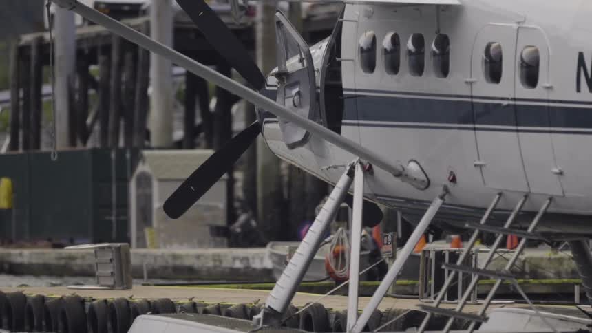 A pontoon plane parked near pier