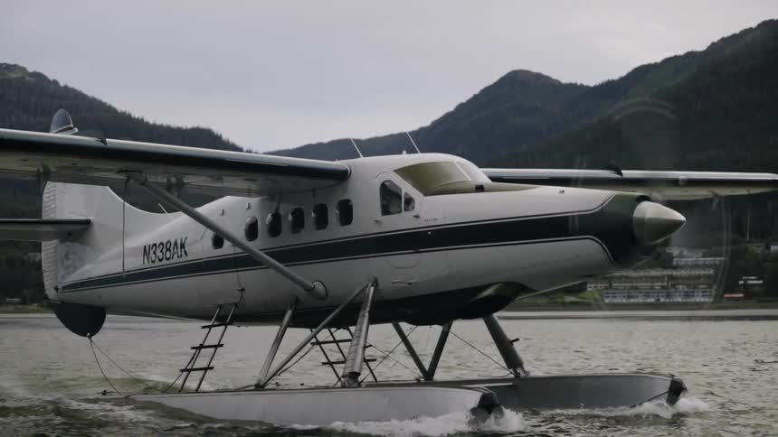 A plane is moving across the water