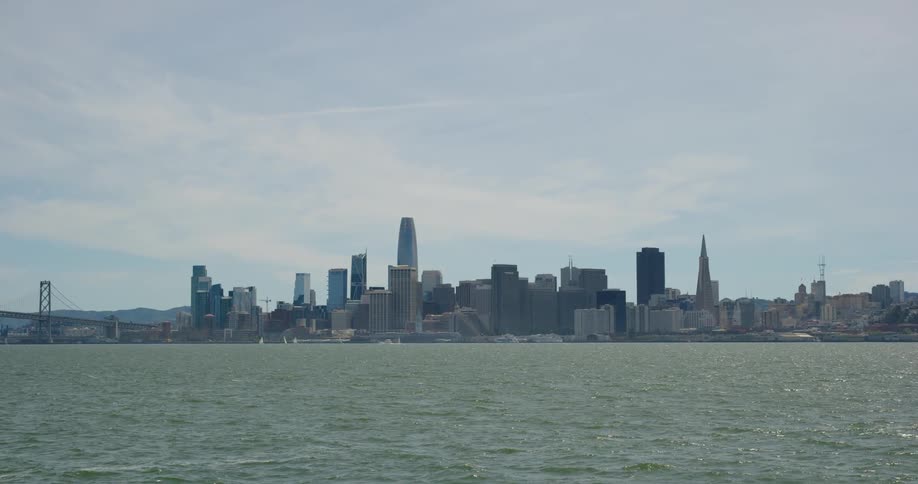 A skyline is shown in the distance near the ocean