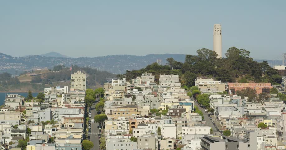 Aerial view of a neighborhood with cars lining the streets