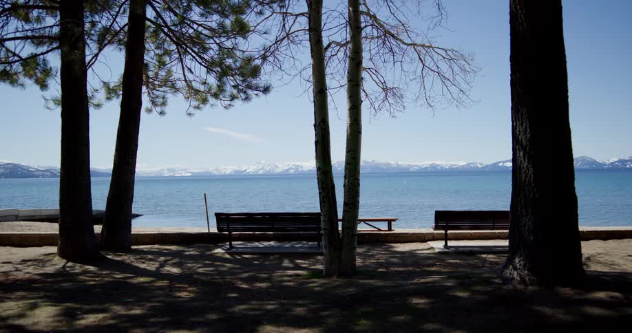 A lake with mountains in the distance