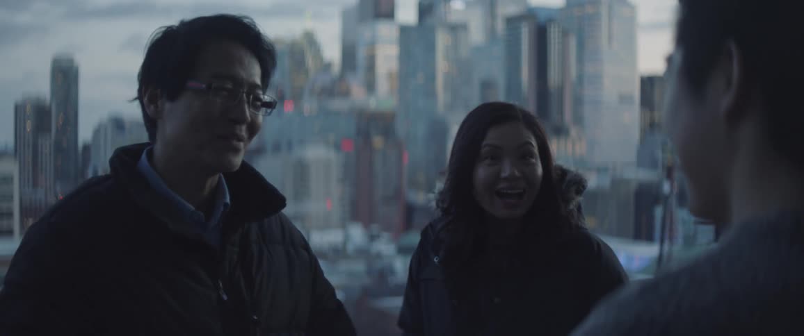 A woman points out some sights in the city as a friend greets them