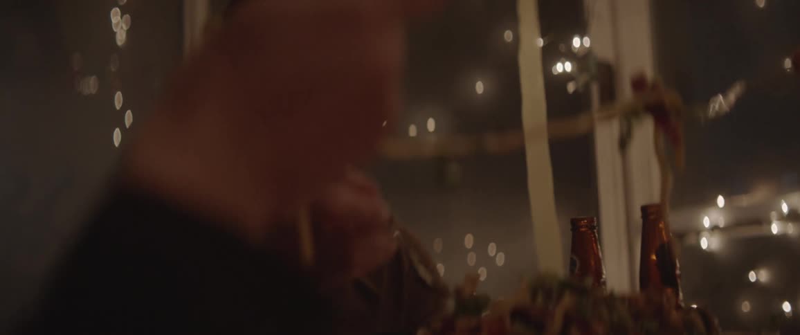 A family eats noodles around a table
