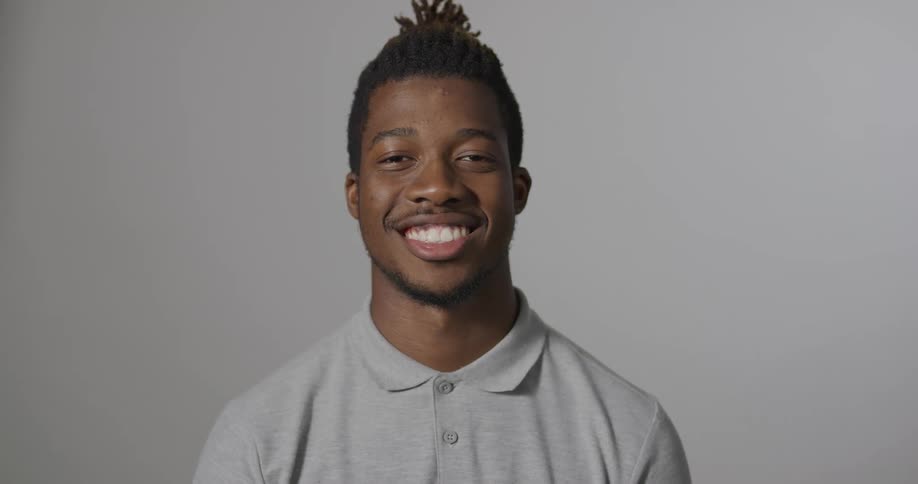A teenage boy smiles for a photo