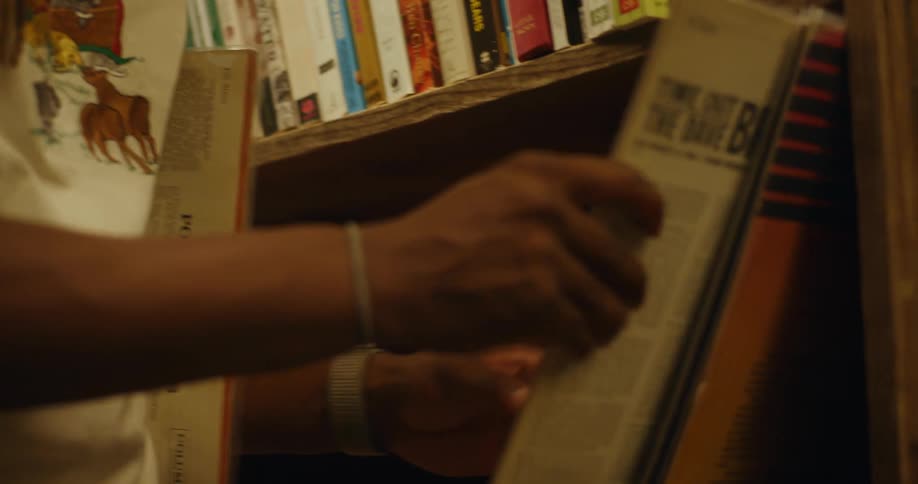 A man looks through albums on a record store shelf