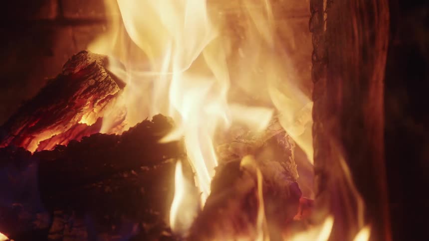 Flames rising as wood burns