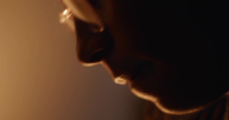 Close up of a teenage boys face as he moves to a beat