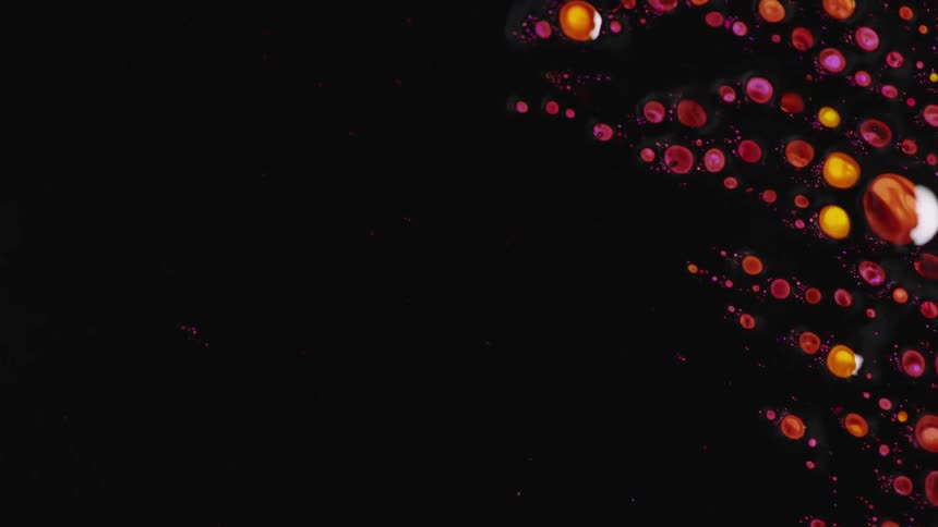 Movement of a dark shiny liquid