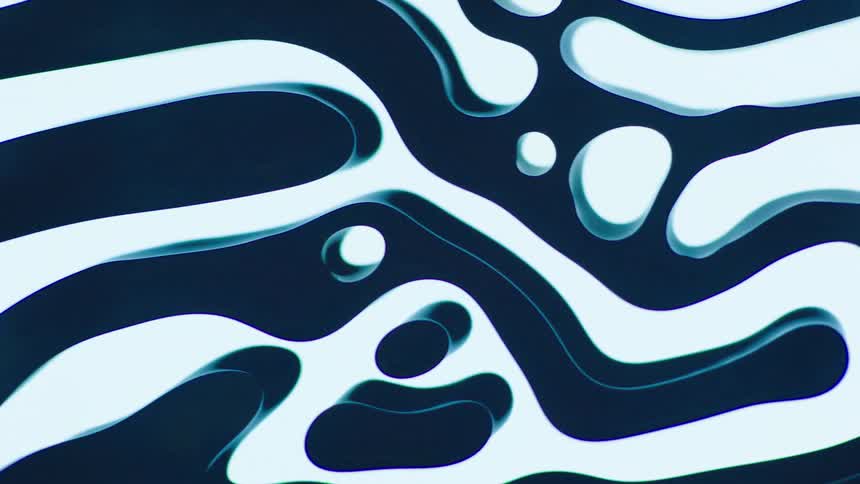 A dark blue fluid moves in swirled lines across glass