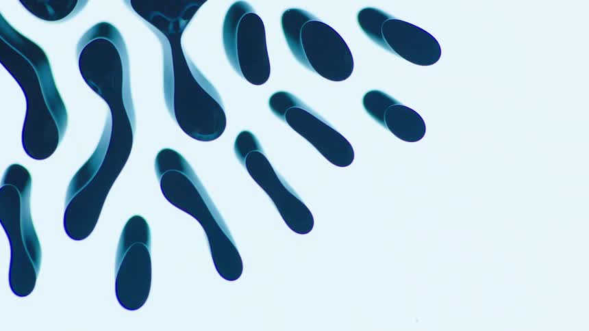 Dark blue liquid flowing over a white surface