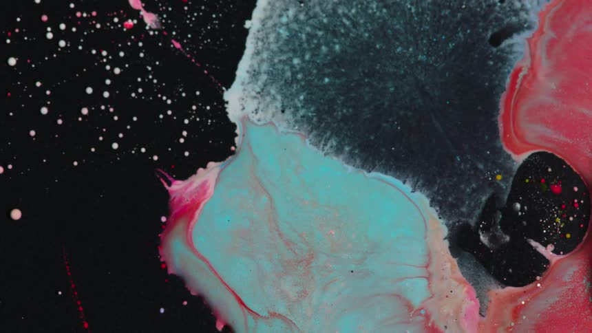 Different color paints flowing and mixing