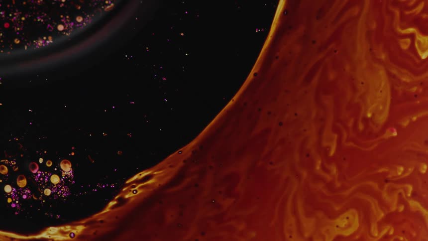 Black brown purple and orange colors that look like oil and water