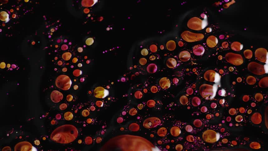 Movement of brown and purple liquid