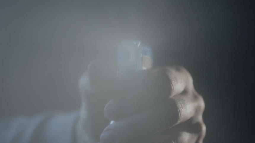 A person is cleaning with a spray bottle