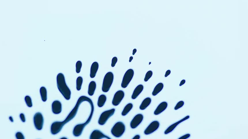 Blue fluid moving in unison all over a white surface