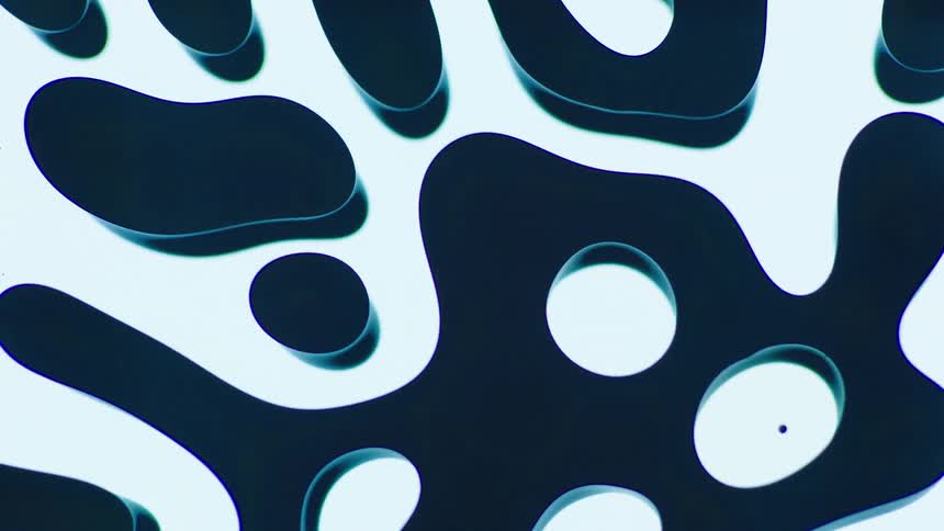 Dark blue fluid flowing over a white surface