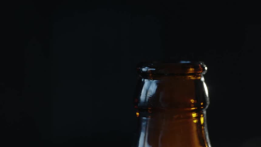 A man opening a bottle of beer