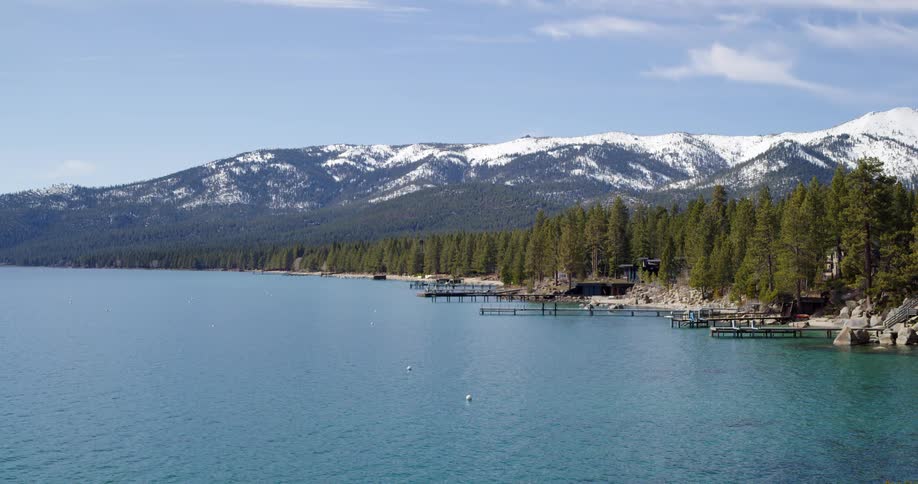 The lake is near the snow covered mountain