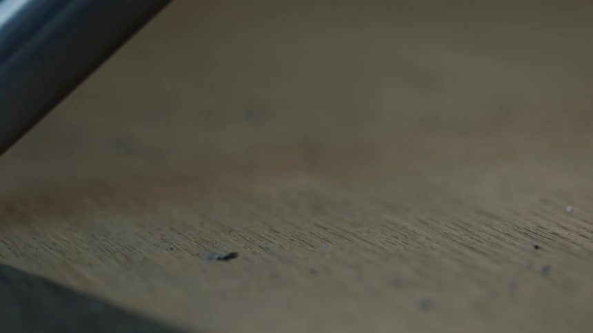 A vacuum sucking up dust